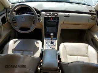 2000 Mercedes-Benz E-Class AWD with VIN WDBJH82J8YX042547, listed as a Copart auction lot 58063494 with 138,392 mi miles and Salvage Title. Bid and sale history available at carsss.com. Image 8.