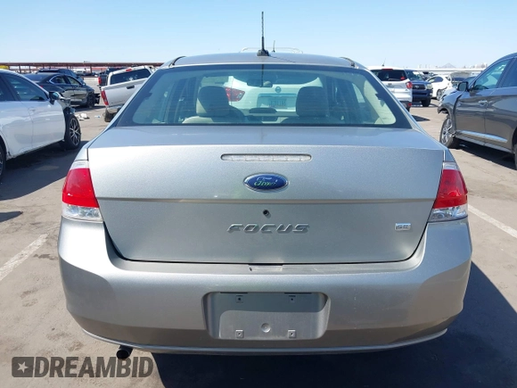 2008 Ford Focus SE with VIN 1FAHP35N68W154490, listed as a IAAI auction lot 42128643 with 141,316 mi miles. Bid and sale history available at carsss.com. Image 16.