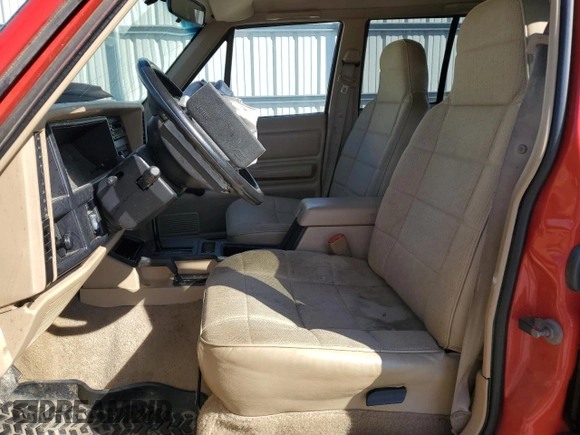 1995 Jeep Cherokee Sport with VIN 1J4FJ68S2SL666126, listed as a Copart auction lot 50496735 with 158,523 mi miles and Salvage title. Bid and sale history available at DreamBid. Image 7.