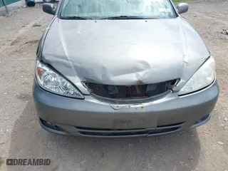 2004 Toyota Camry LE with VIN 4T1BE32K04U853924, listed as a IAAI auction lot 42114407 with 246,272 mi miles. Bid and sale history available at carsss.com. Image 6.