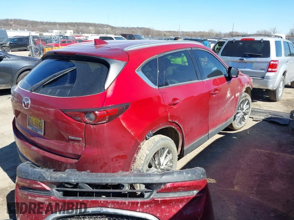 2020 Mazda CX-5 Grand Touring with VIN JM3KFADM3L0761286, listed as a IAAI auction lot 41715379 with 145,656 mi miles and . Bid and sale history available at DreamBid. Image 4.