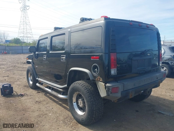 2005 Hummer H2 SUV with VIN 5GRGN23U05H128420, listed as a IAAI auction lot 41983395 with 194,925 mi miles. Bid and sale history available at carsss.com. Image 3.
