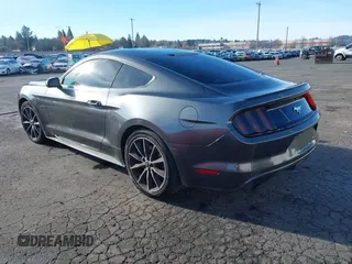 2015 Ford Mustang EcoBoost z VIN 1FA6P8TH7F5351477, wystawiony jako IAAI lot #41378347 z przebiegiem 104 755 mil mil oraz . Historia ofert i sprzedaży dostępna na DreamBid. Obrazek 3.