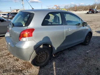 2010 Toyota Yaris with VIN JTDJT4K38A5291023, listed as a Copart auction lot 48483545 with 118,035 mi miles and Salvage Title. Bid and sale history available at carsss.com. Image 3.