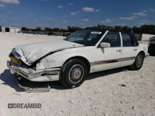 1991 Cadillac Seville z VIN 1G6KS53B9MU824142, wystawiony jako Copart lot #74276264 z przebiegiem 103 517 mil mil oraz Szkody całkowita. Historia ofert i sprzedaży dostępna na DreamBid. Obrazek 1.