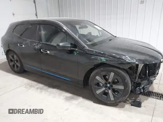 2023 BMW iX xDrive50 with VIN WB523CF04PCL15607, listed as a IAAI auction lot 41315457 with 44,058 mi miles. Bid and sale history available at carsss.com. Image 1.