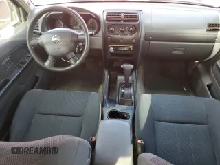 2003 Nissan Frontier XE with VIN 1N6ED27T13C409632, listed as a Copart auction lot 84884434 with 194,167 mi miles and Salvage title. Bid and sale history available at DreamBid. Image 8.