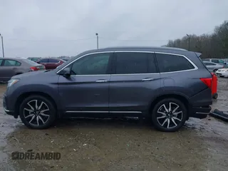 2021 Honda Pilot Touring 8-Passenger with VIN 5FNYF5H9XMB014190, listed as a IAAI auction lot 41749586 with 67,602 mi miles and . Bid and sale history available at DreamBid. Image 15.