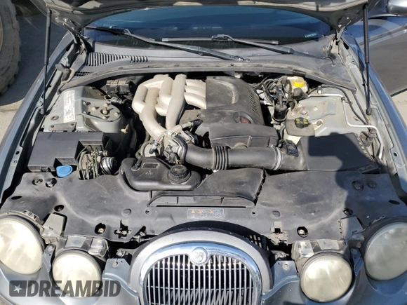 2005 Jaguar S-Type with VIN SAJWA01T15FN13800, listed as a Copart auction lot 53576305 with 182,533 mi miles and Salvage Title. Bid and sale history available at DreamBid. Image 11.
