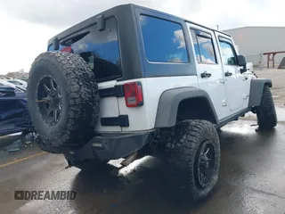 2014 Jeep Wrangler Unlimited Rubicon with VIN 1C4BJWFG2EL264792, listed as a IAAI auction lot 40938380 with 145,886 mi miles. Bid and sale history available at carsss.com. Image 4.