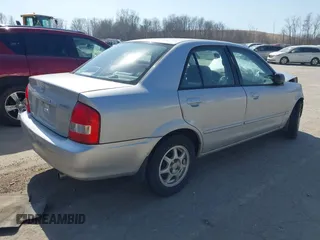 2000 Mazda Protege DX with VIN JM1BJ2227Y0240819, listed as a IAAI auction lot 41810228 with 68,650 mi miles and . Bid and sale history available at DreamBid. Image 4.