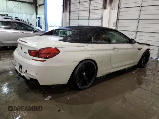 2016 BMW M6 z VIN WBS6G9C58GD932069, wystawiony jako Copart lot #55722063 z przebiegiem 61 793 mil mil oraz . Historia ofert i sprzedaży dostępna na DreamBid. Obrazek 3.