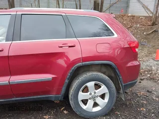 2012 Jeep Grand Cherokee Laredo with VIN 1C4RJFAG7CC123669, listed as a IAAI auction lot 42001472 with 164,806 mi miles. Bid and sale history available at carsss.com. Image 19.