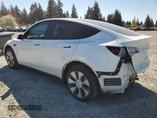 2023 Tesla Model Y Long Range z VIN 7SAYGDEE7PF788932, wystawiony jako Copart lot #52822515 z przebiegiem 33 007 mil mil oraz Szkoda całkowita • Salvage title. Historia ofert i sprzedaży dostępna na DreamBid. Obrazek 2.