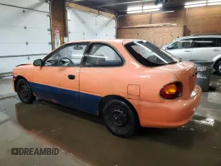 1997 Hyundai Accent z VIN KMHVD14NXVU221266, wystawiony jako Copart lot #86383044 z przebiegiem 159 517 mil mil oraz Szkody całkowita. Historia ofert i sprzedaży dostępna na DreamBid. Obrazek 2.