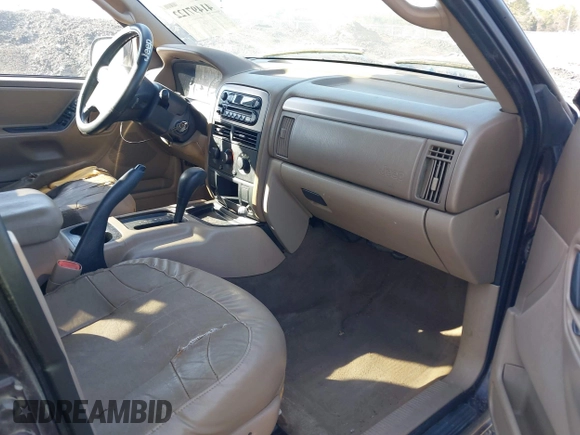 2004 Jeep Grand Cherokee with VIN 1J8GX48S24C266933, listed as a IAAI auction lot 41497122 with 200,899 mi miles and . Bid and sale history available at DreamBid. Image 5.