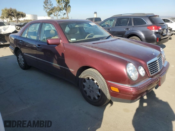 1998 Mercedes-Benz E 320 with VIN WDBJF25FXWA549962, listed as a Copart auction lot 87876005 with 303,884 mi miles and Salvage Title. Bid and sale history available at DreamBid. Image 4.