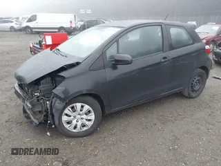 2014 Toyota Yaris L with VIN VNKJTUD30EA010981, listed as a IAAI auction lot 41275154 with 1 mi miles. Bid and sale history available at carsss.com. Image 2.