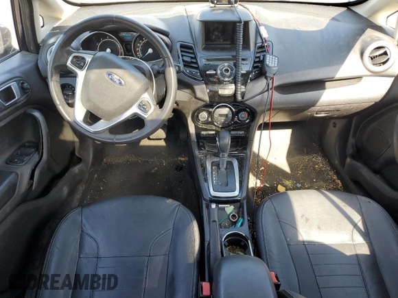 2016 Ford Fiesta Titanium z VIN 3FADP4CJ7GM157983, wystawiony jako Copart lot #75773954 z przebiegiem 149 363 mil mil oraz Szkoda całkowita • Salvage title. Historia ofert i sprzedaży dostępna na DreamBid. Obrazek 8.