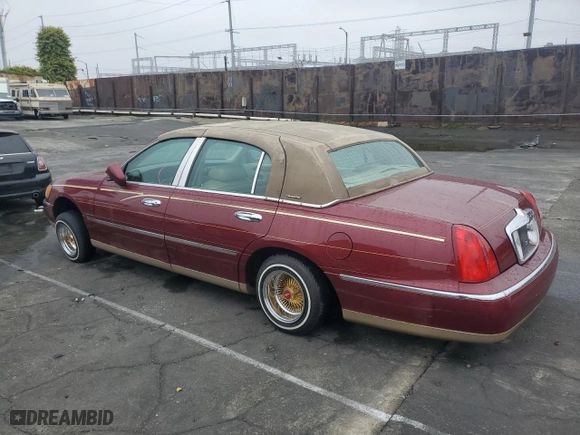 1999 Lincoln Town Car Signature with VIN 1LNHM82W7XY612906, listed as a Copart auction lot 50777435 with 110,414 mi miles and Salvage Title. Bid and sale history available at carsss.com. Image 2.