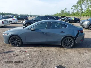 2024 Mazda 3 S Carbon Edition with VIN 3MZBPBCM6RM411828, listed as a IAAI auction lot 42802141 with 40,061 mi miles and . Bid and sale history available at DreamBid. Image 14.
