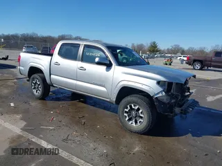 2016 Toyota Tacoma SR with VIN 5TFCZ5ANXGX017531, listed as a IAAI auction lot 41704525 with 106,394 mi miles. Bid and sale history available at carsss.com. Image 1.
