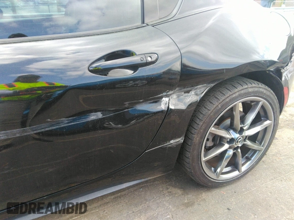 2021 Mazda MX-5 Miata Grand Touring z VIN JM1NDAM75M0451597, wystawiony jako IAAI lot #41932712 z przebiegiem 61 710 mil mil oraz . Historia ofert i sprzedaży dostępna na DreamBid. Obrazek 18.