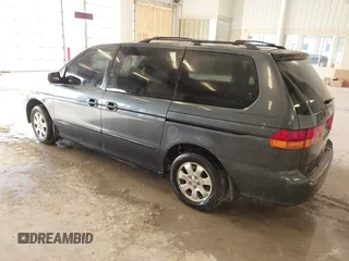 2004 Honda Odyssey EX z VIN 5FNRL18674B050429, wystawiony jako IAAI lot #41655622 z przebiegiem 257 656 mil mil oraz . Historia ofert i sprzedaży dostępna na DreamBid. Obrazek 3.
