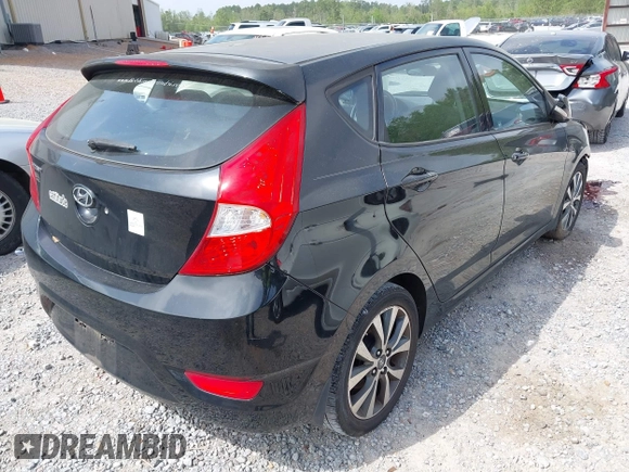 2015 Hyundai Accent Sport with VIN KMHCU5AE5FU233054, listed as a IAAI auction lot 41932298 with 70,278 mi miles. Bid and sale history available at carsss.com. Image 4.