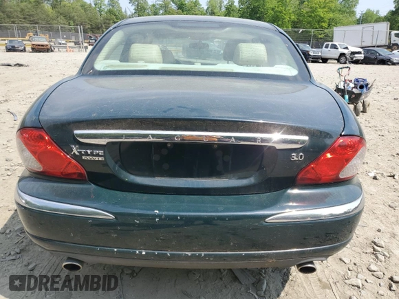 2004 Jaguar X-Type with VIN SAJEA51C64WE17722, listed as a Copart auction lot 55416405 with 89,047 mi miles and Salvage Title. Bid and sale history available at DreamBid. Image 6.