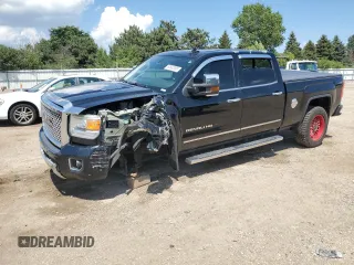 2015 GMC Sierra 2500HD Denali with VIN 1GT120E8XFF610586, listed as a Copart auction lot 62582865 with 160,449 mi miles and Salvage title. Bid and sale history available at DreamBid. Image 1.