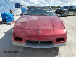 1987 Pontiac Fiero GT z VIN 1G2PG1195HP233666, wystawiony jako Copart lot #78981714 z przebiegiem Nie podano mil oraz Szkody całkowita. Historia ofert i sprzedaży dostępna na DreamBid. Obrazek 5.