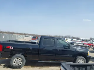 2012 Chevrolet Silverado 2500HD LT with VIN 1GC1KXCG2CF156820, listed as a IAAI auction lot 41713118 with 143,893 mi miles. Bid and sale history available at carsss.com. Image 13.