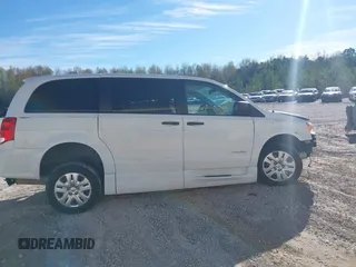 2019 Dodge Grand Caravan SE with VIN 2C7WDGBG7KR803126, listed as a IAAI auction lot 40835937 with 63,100 mi miles and . Bid and sale history available at DreamBid. Image 14.