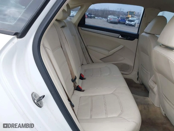 2014 Volkswagen Passat Wolfsburg Ed with VIN 1VWAT7A38EC087906, listed as a IAAI auction lot 41623631 with 124,079 mi miles. Bid and sale history available at carsss.com. Image 8.