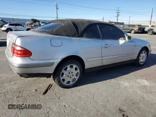 1999 Mercedes-Benz CLK 320/430 z VIN WDBLK65G2XT024808, wystawiony jako Copart lot #85336294 z przebiegiem 289 898 mil mil oraz Szkoda całkowita • Salvage title. Historia ofert i sprzedaży dostępna na DreamBid. Obrazek 3.