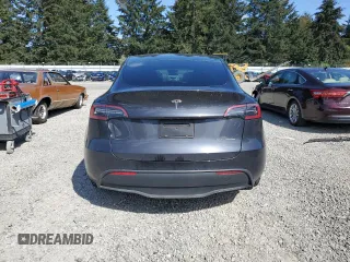 2024 Tesla Model Y Long Range with VIN 7SAYGAEE8RF987571, listed as a Copart auction lot 55110485 with 19,732 mi miles and Salvage title. Bid and sale history available at DreamBid. Image 6.