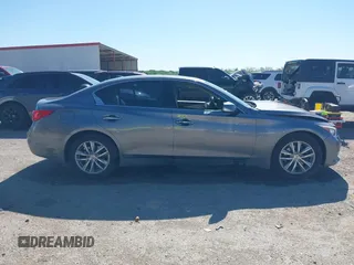 2015 Infiniti Q50 Premium z VIN JN1BV7AR9FM408386, wystawiony jako IAAI lot #42084887 z przebiegiem 122 527 mil mil oraz . Historia ofert i sprzedaży dostępna na DreamBid. Obrazek 14.