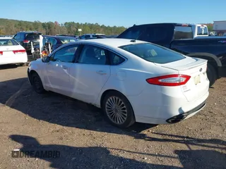 2016 Ford Fusion Titanium with VIN 3FA6P0K98GR150939, listed as a IAAI auction lot 40994523 with 144,051 mi miles. Bid and sale history available at carsss.com. Image 3.