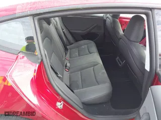 2024 Tesla Model 3 with VIN 5YJ3E1EA7RF869098, listed as a IAAI auction lot 41477093 with 3,869 mi miles. Bid and sale history available at carsss.com. Image 8.