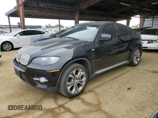 2011 BMW X6 50i with VIN 5UXFG8C56BLZ96125, listed as a Copart auction lot 84271244 with 69,732 mi miles and Salvage Title. Bid and sale history available at carsss.com. Image 1.