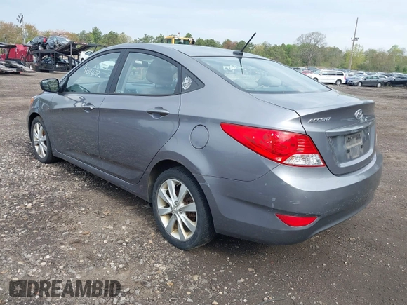 2014 Hyundai Accent GLS with VIN KMHCU4AE9EU761298, listed as a IAAI auction lot 42186032 with 118,848 mi miles and . Bid and sale history available at carsss.com. Image 3.