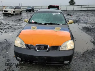 2004 Suzuki Forenza z VIN KL5JJ52Z44K953823, wystawiony jako Copart lot #86589504 z przebiegiem 150 699 mil mil oraz Tytuł czysty. Historia ofert i sprzedaży dostępna na DreamBid. Obrazek 5.