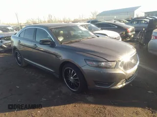 2014 Ford Taurus SHO with VIN 1FAHP2KT4EG140364, listed as a IAAI auction lot 35451709 with 82,904 mi miles. Bid and sale history available at carsss.com. Image 1.