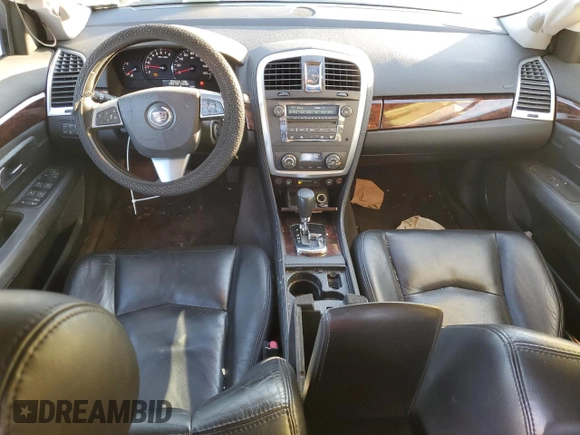 2009 Cadillac SRX RWD z VIN 1GYEE637890117173, wystawiony jako Copart lot #42098225 z przebiegiem 124 902 mil mil oraz Szkoda całkowita • Salvage title. Historia ofert i sprzedaży dostępna na DreamBid. Obrazek 8.
