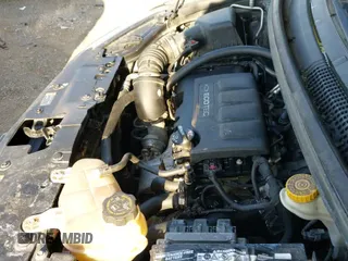 2018 Chevrolet Sonic LT z VIN 1G1JD5SB8J4102265, wystawiony jako IAAI lot #42556726 z przebiegiem 158 586 mil mil oraz . Historia ofert i sprzedaży dostępna na DreamBid. Obrazek 19.