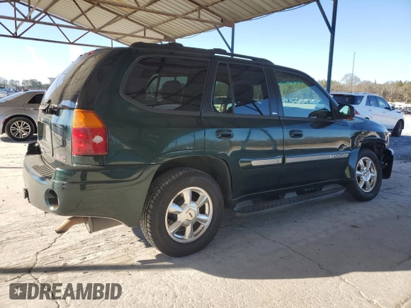2004 GMC Envoy SLT z VIN 1GKDS13S942127830, wystawiony jako Copart lot #87165024 z przebiegiem 172 592 mil mil oraz Szkoda całkowita • Salvage title. Historia ofert i sprzedaży dostępna na DreamBid. Obrazek 3.