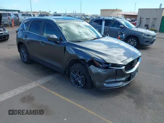 2021 Mazda CX-5 Touring with VIN JM3KFACM2M1348305, listed as a IAAI auction lot 41627199 with 30,044 mi miles. Bid and sale history available at carsss.com. Image 1.