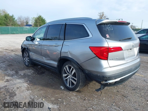 2016 Honda Pilot Touring with VIN 5FNYF6H90GB024902, listed as a IAAI auction lot 41948563 with 148,598 mi miles. Bid and sale history available at carsss.com. Image 3.
