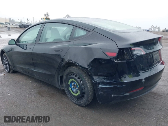 2023 Tesla Model 3 with VIN 5YJ3E1EA0PF587656, listed as a IAAI auction lot 41489586 with 12,844 mi miles and . Bid and sale history available at DreamBid. Image 3.
